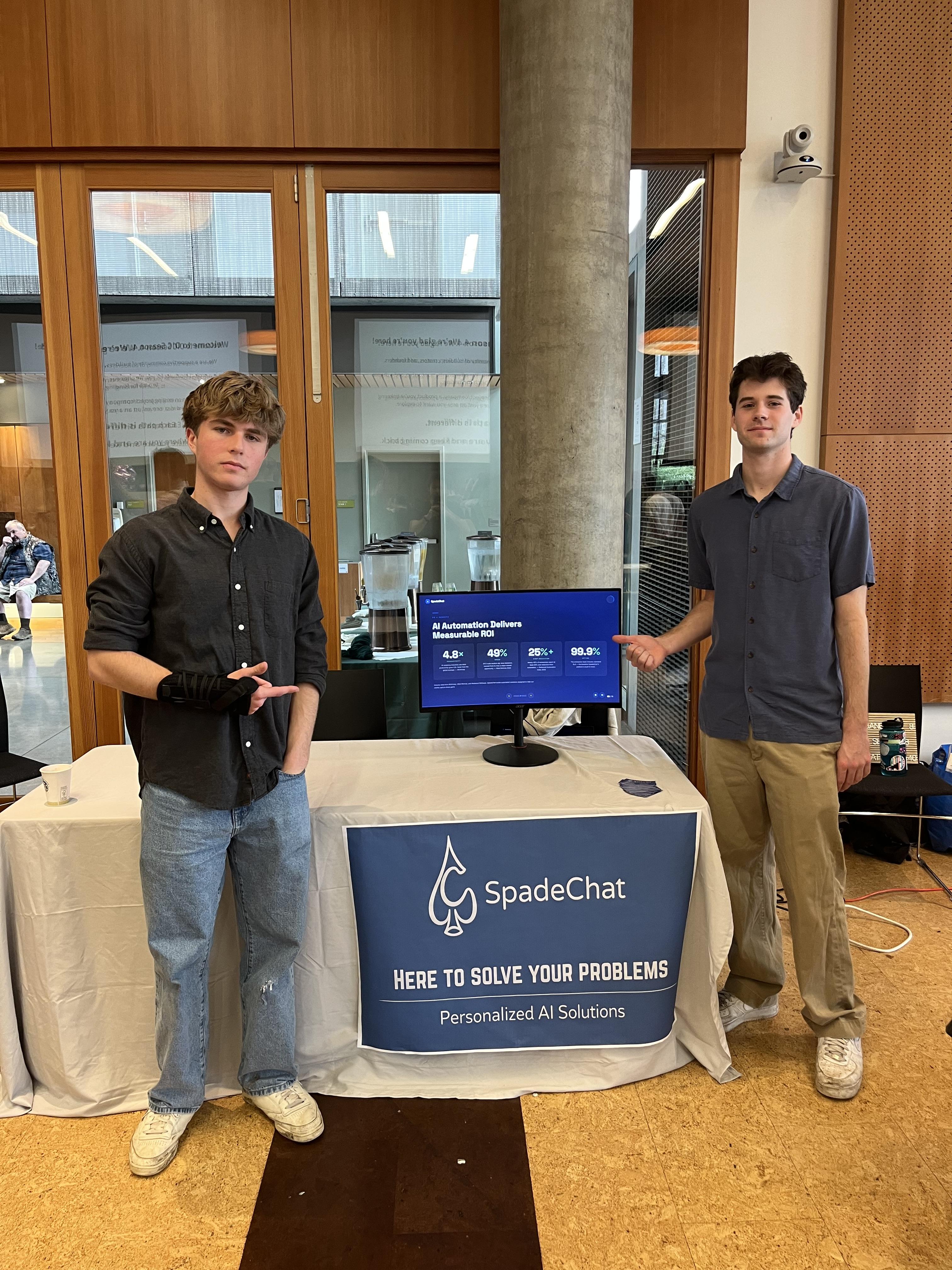 SpadeChat founders at their booth